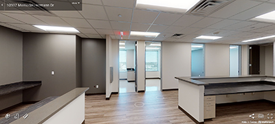 A picture containing indoor, building, sitting, black
Description automatically generated